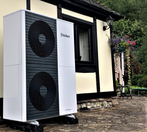 Solutions for Sustainable Heating: Navigating Heat Pumps. Heat pumps shown outside a domestic property